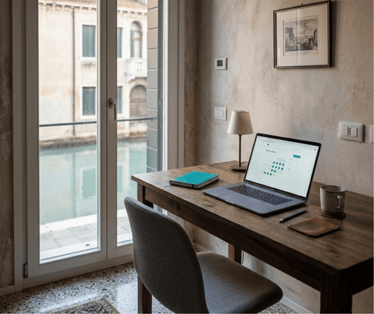 Laptop showing a booking calendar on a desk in a Venetian apartment overlooking a canal — Airbnb rate discipline vs occupancy chasing, AQ Digital